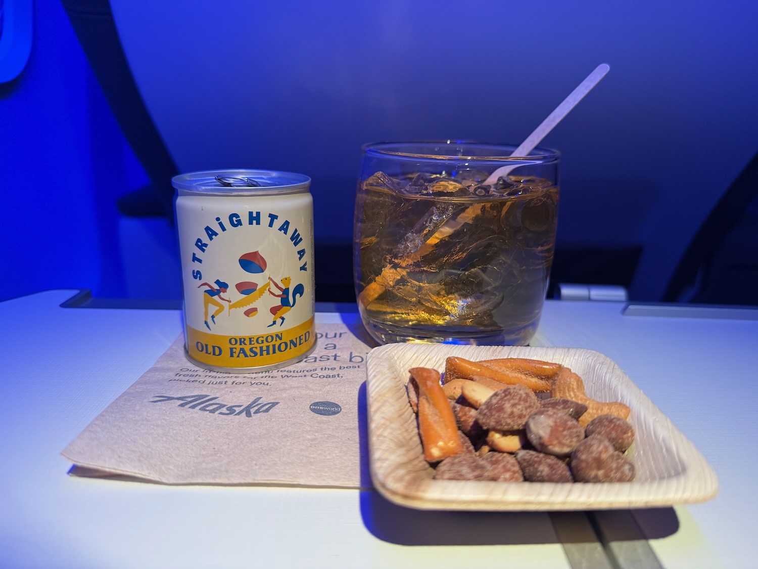 a plate of snacks and a drink on a table