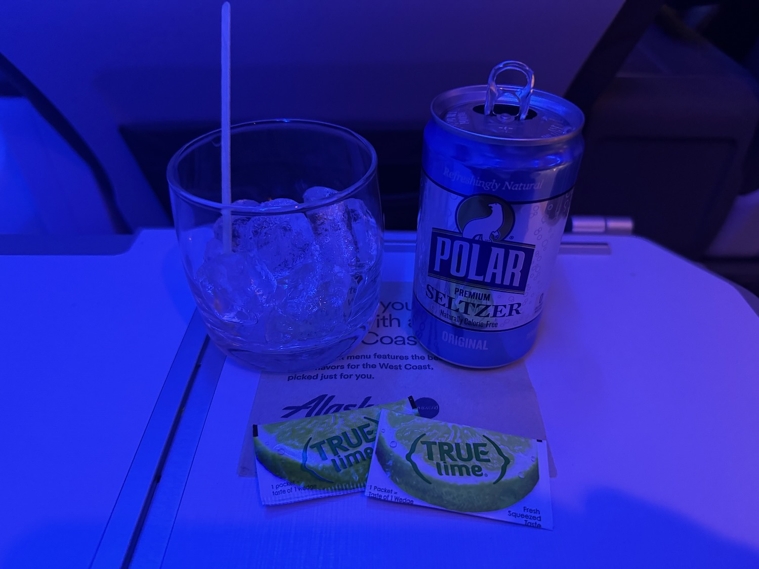 a drink and a can on a table