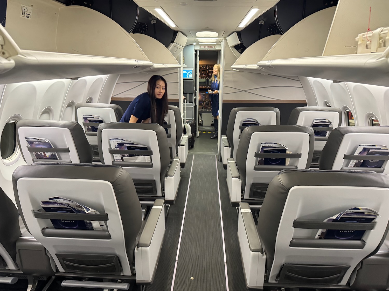 a woman sitting in an airplane