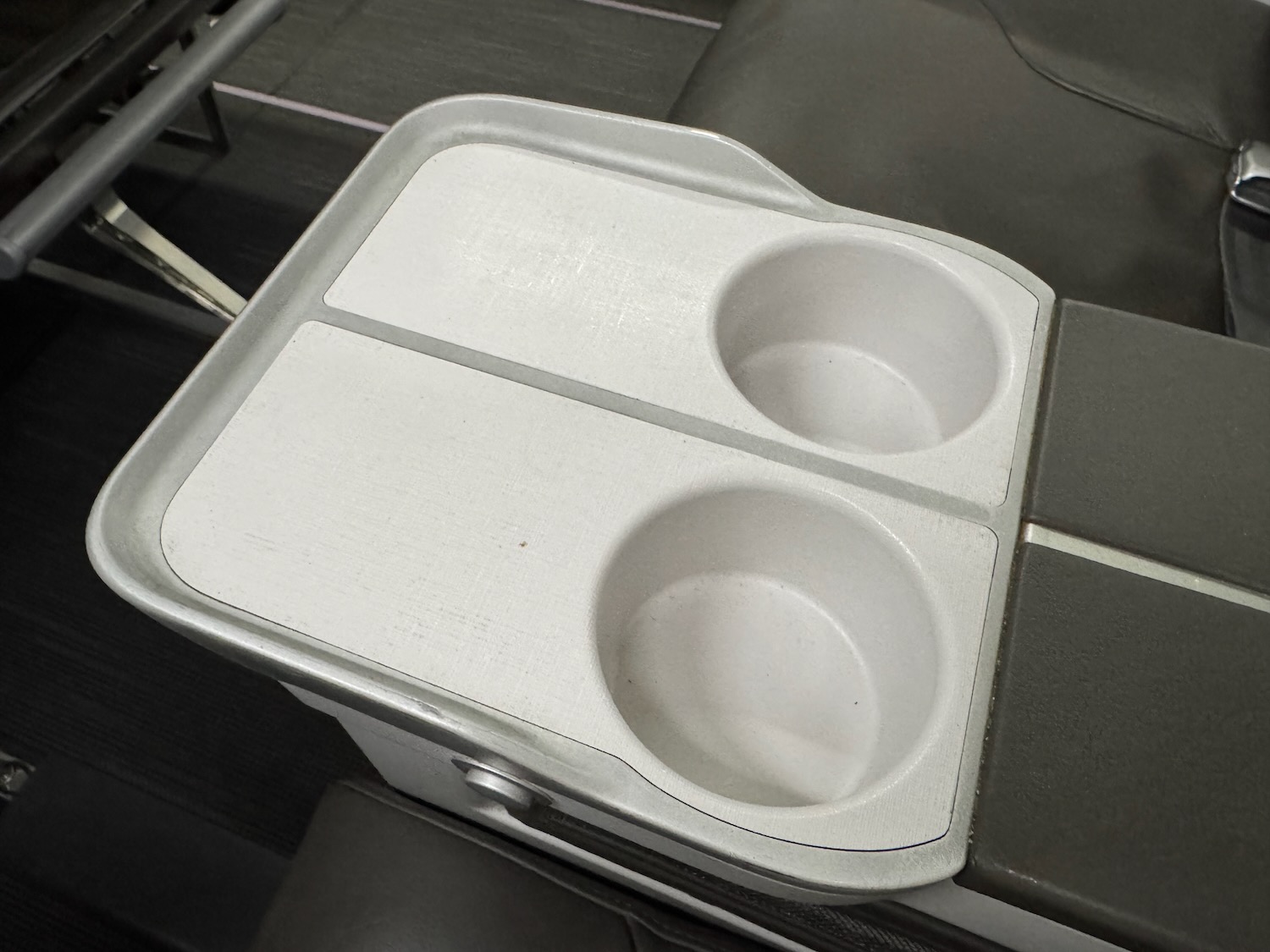 a white and grey cooler with two bowls