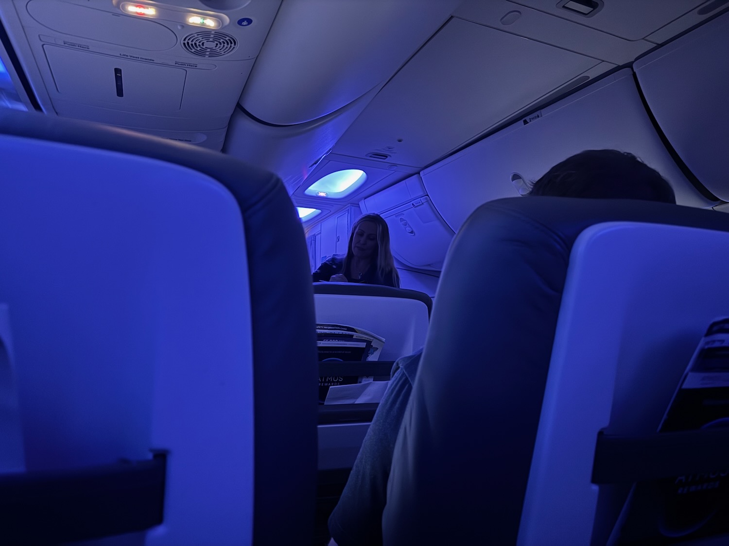 a woman sitting in an airplane