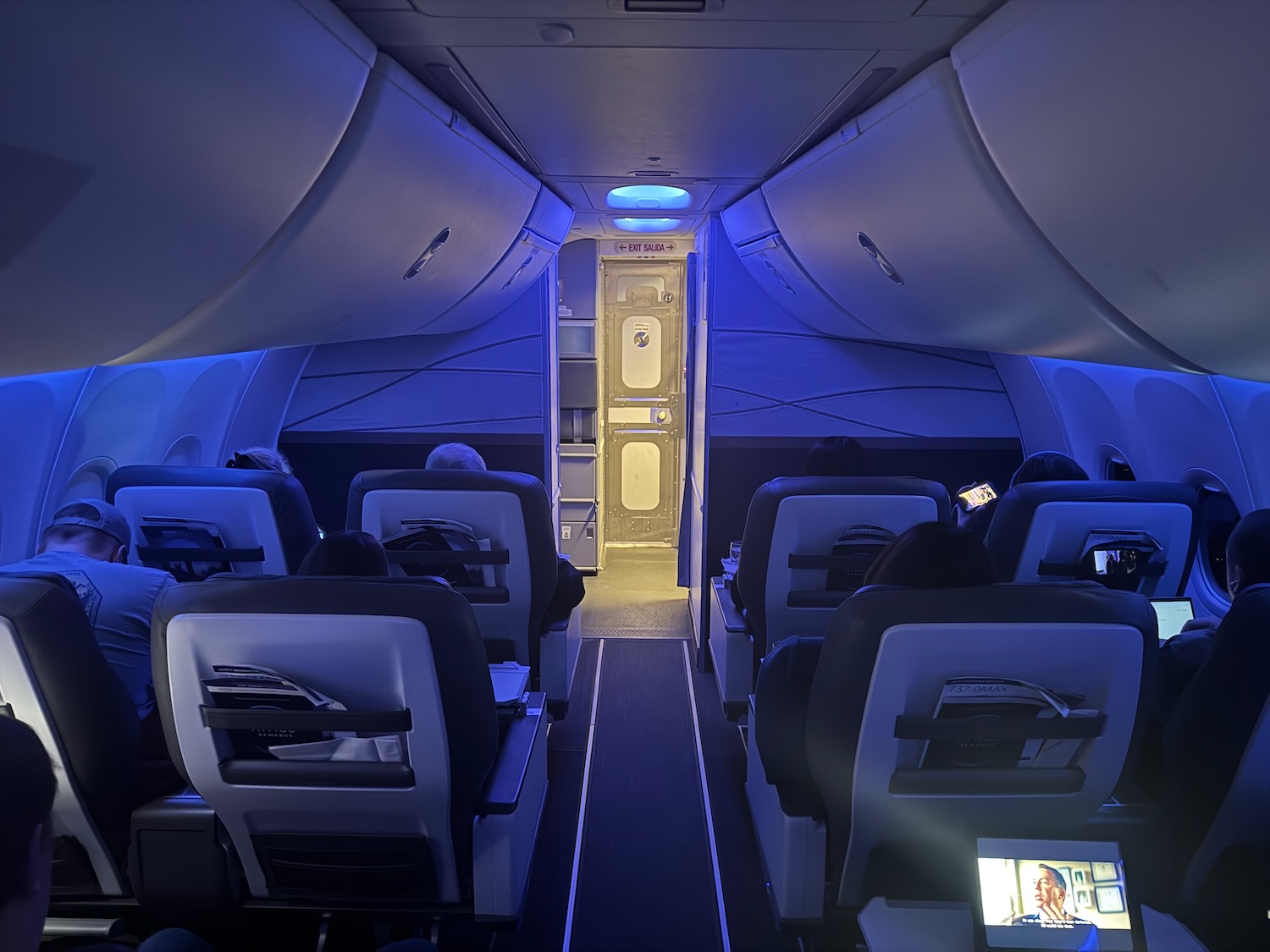 a plane with seats and a tv