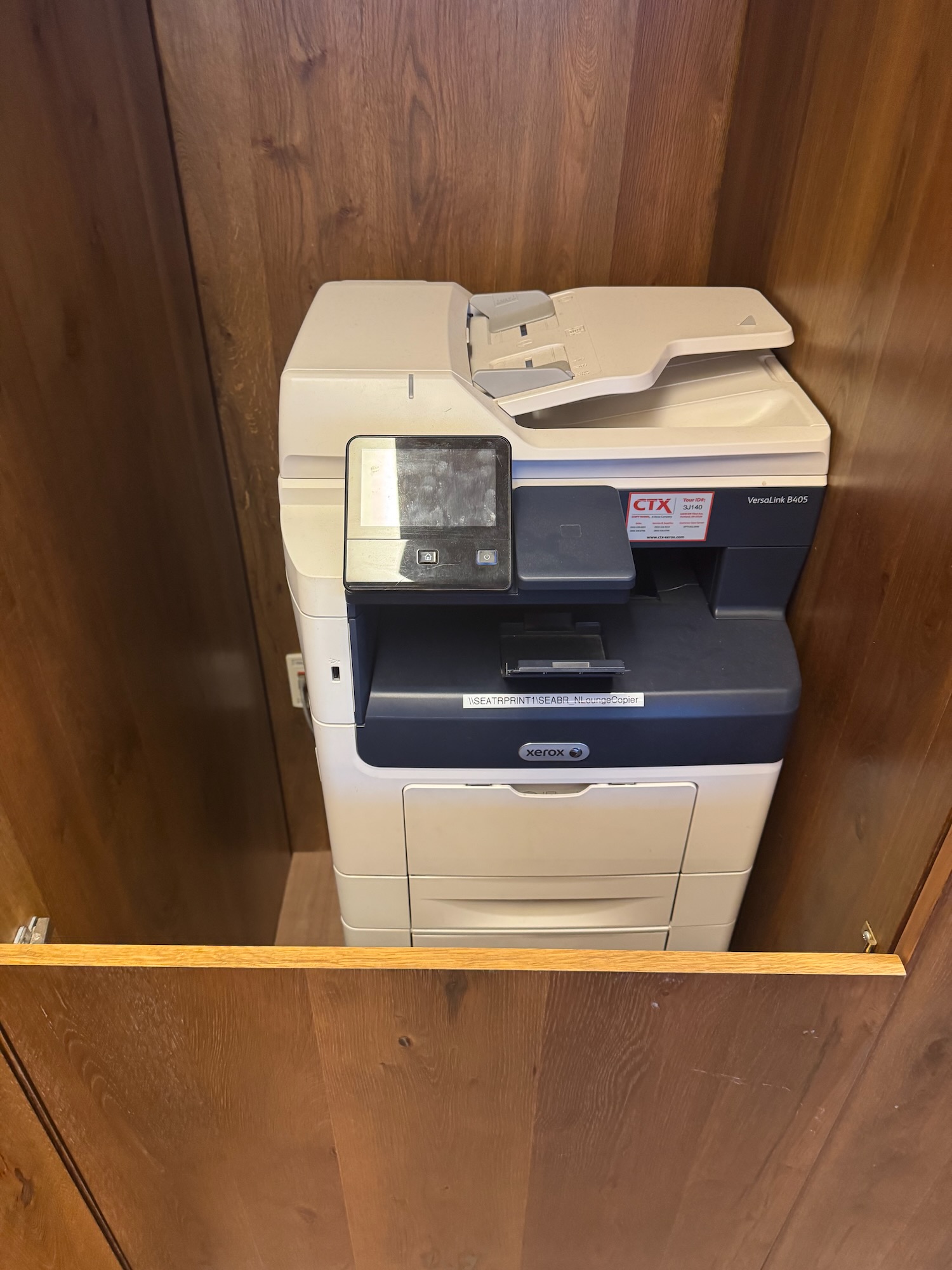 a printer in a cabinet