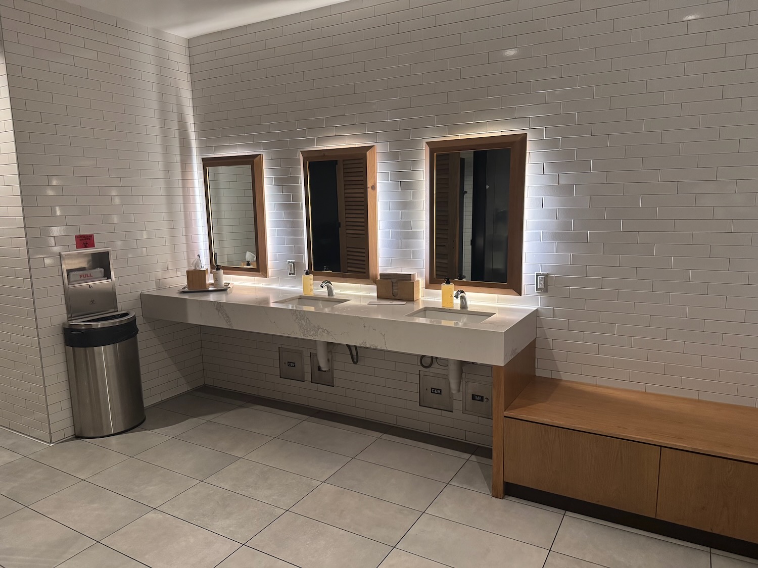 a bathroom with sinks and mirrors