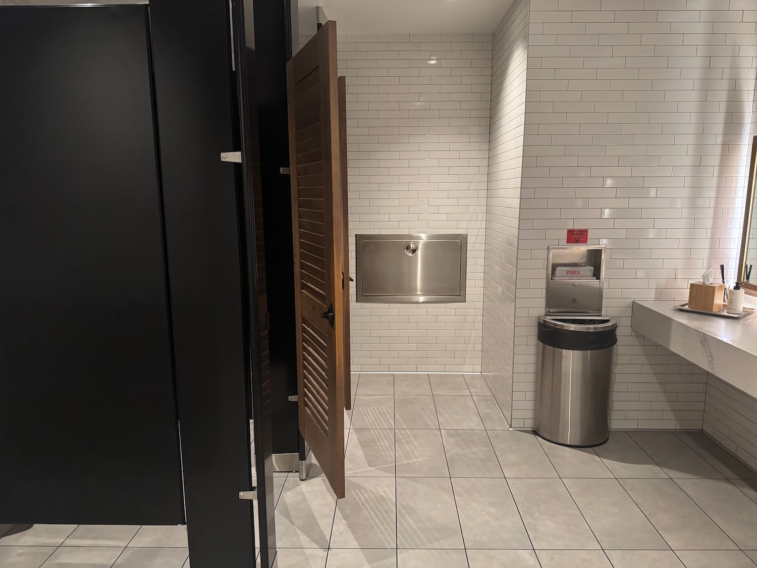 a bathroom with a door and a sink