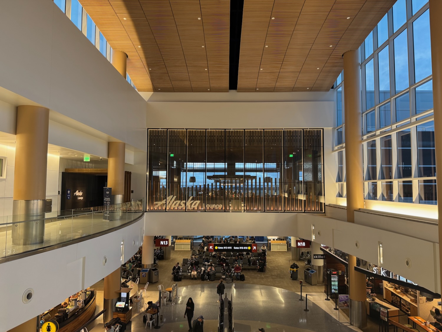 a large building with people walking around