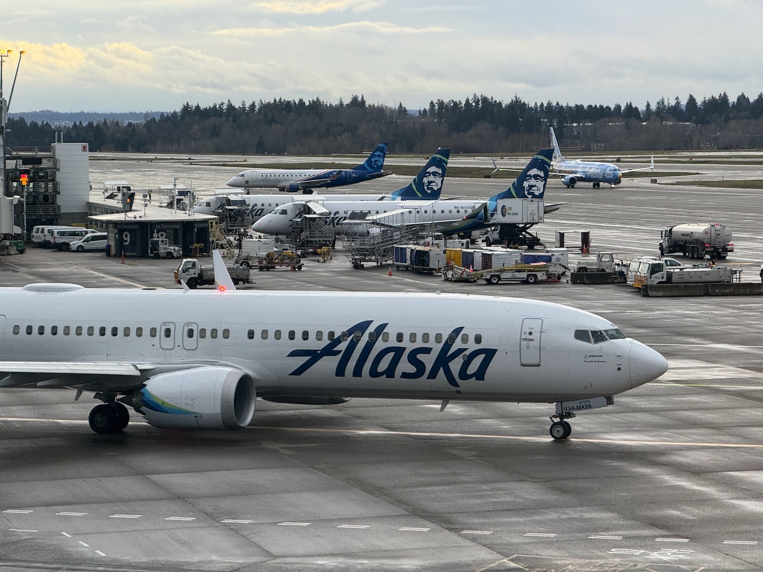 a group of airplanes on a runway