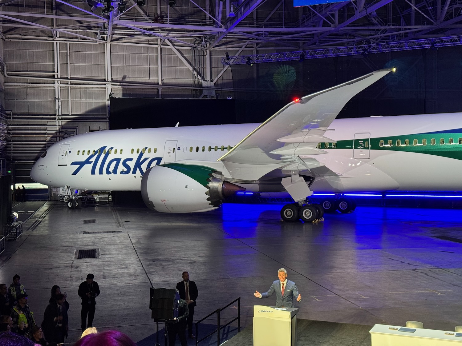 a man standing in front of an airplane