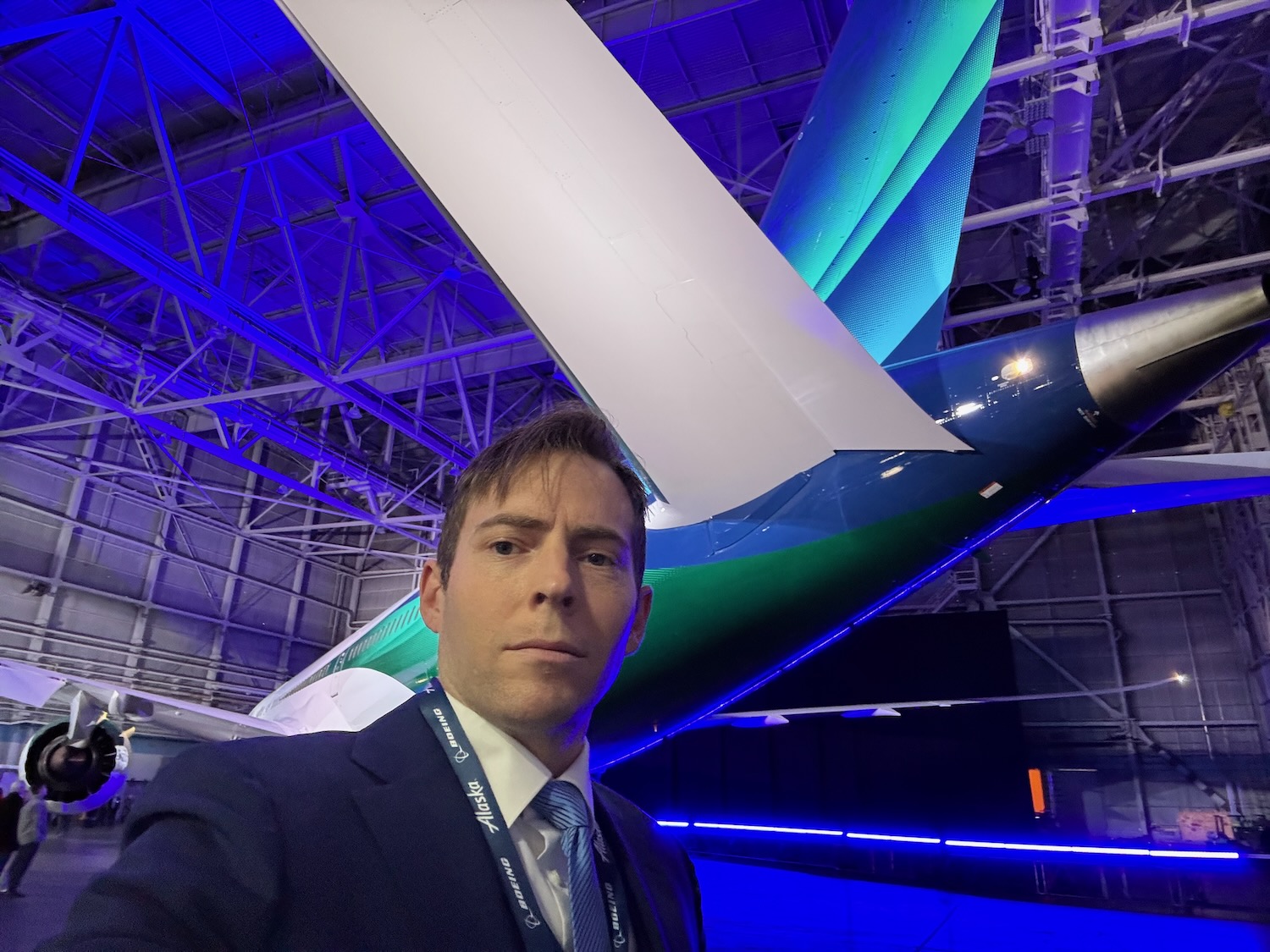 a man taking a selfie in a hangar