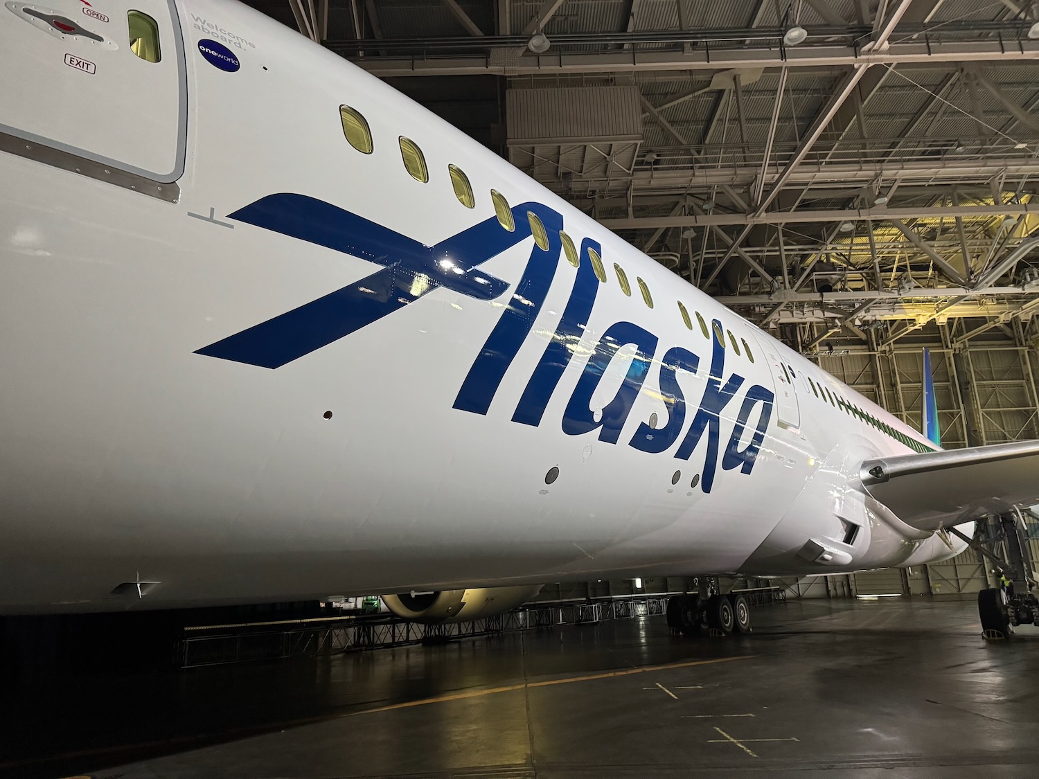 a large white airplane in a hangar