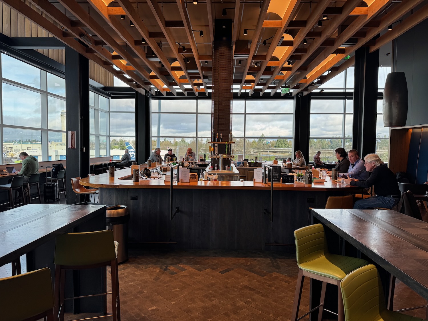 a group of people sitting at a bar