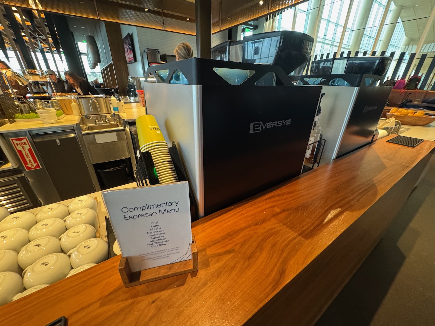 a counter with a sign and a group of white balls