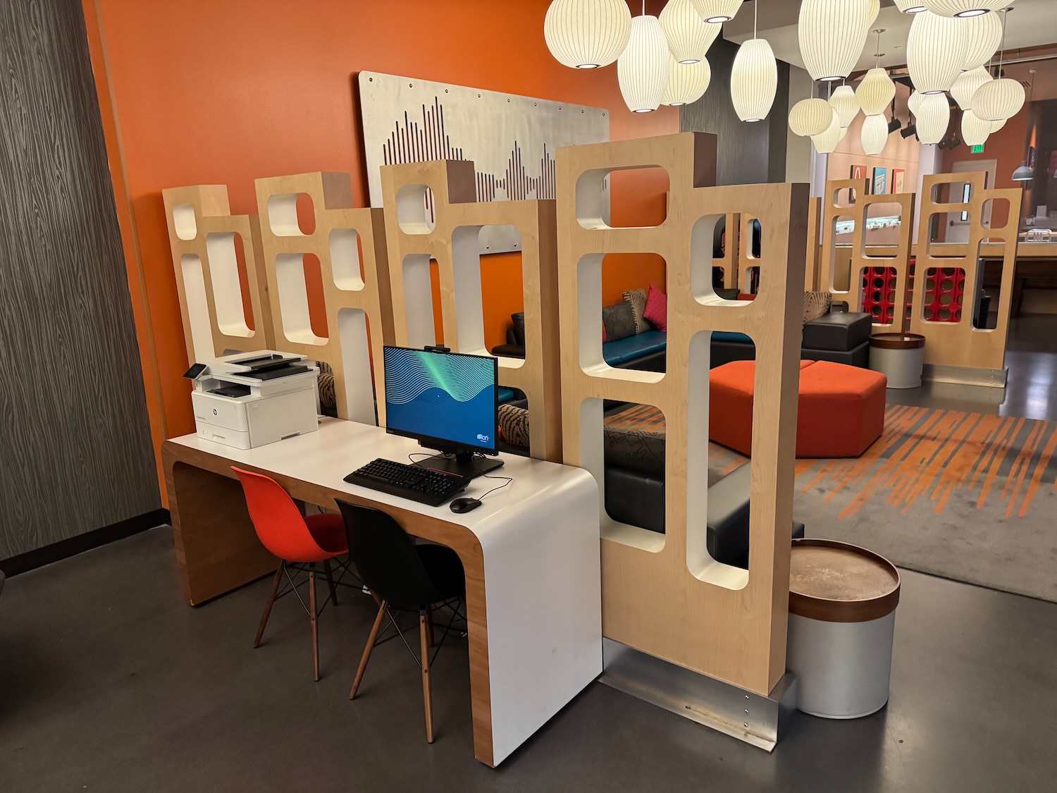 a room with a computer and a screen