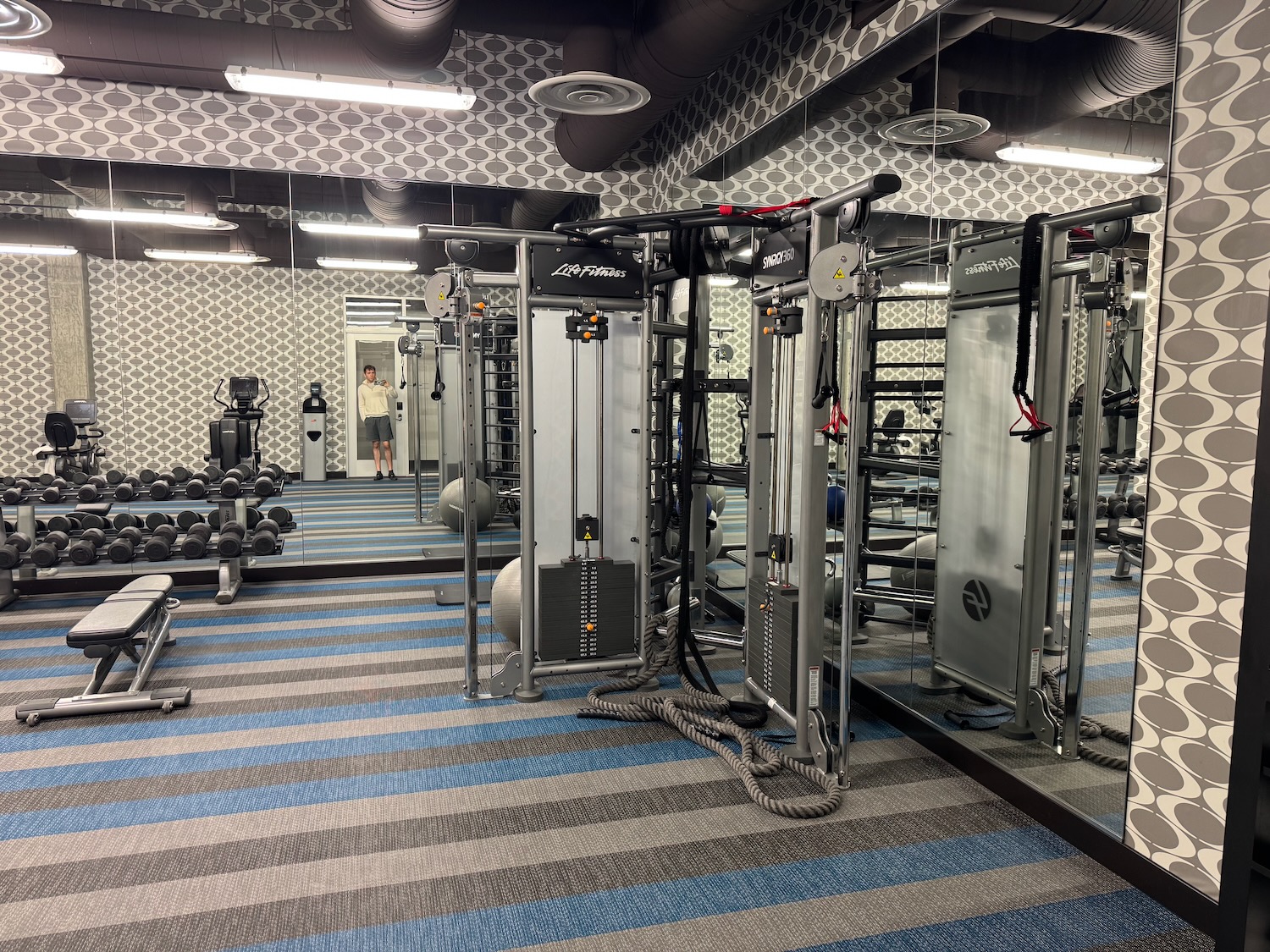 a gym with many equipment