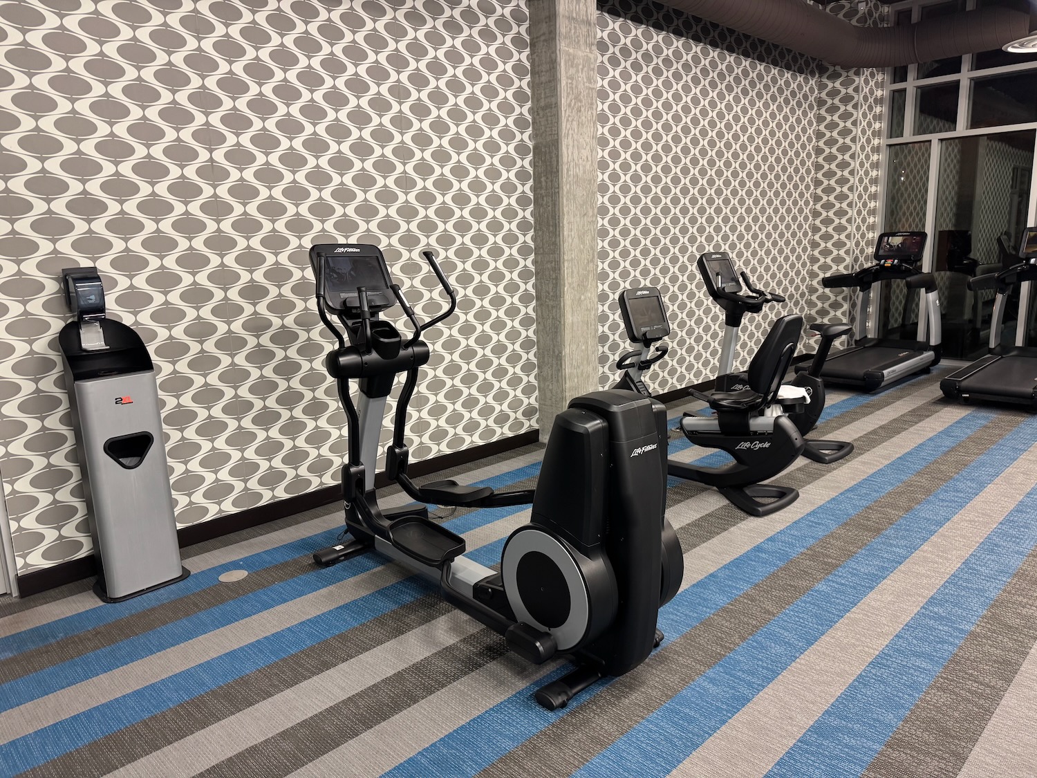 a group of exercise machines in a room