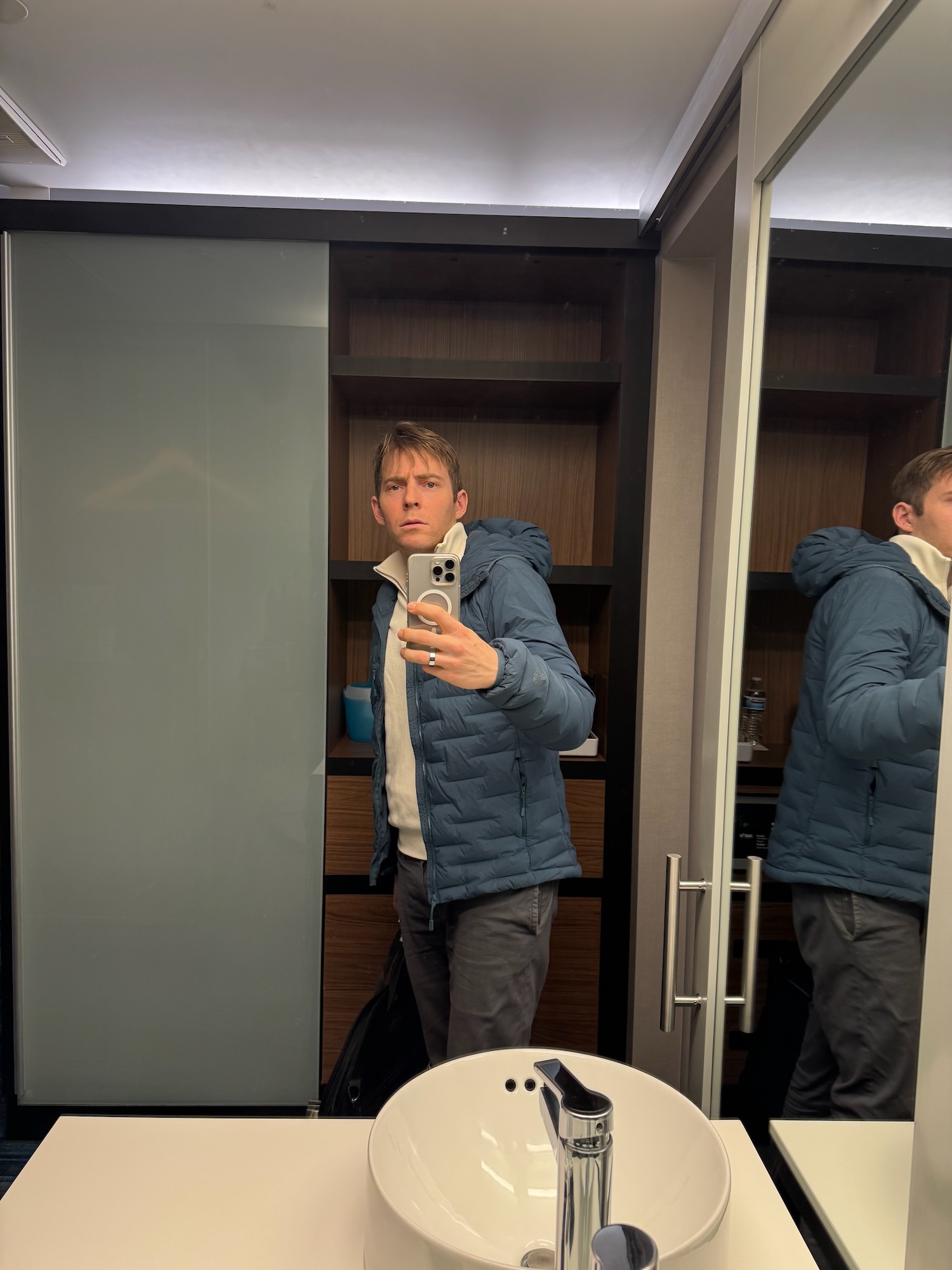 a man taking a selfie in a mirror