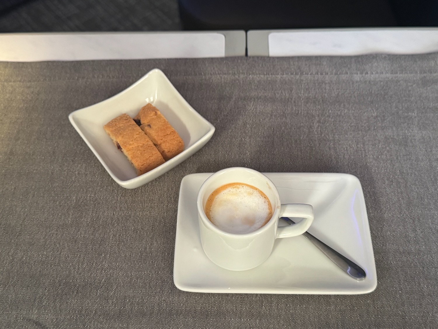 a cup of coffee and a plate of pastries