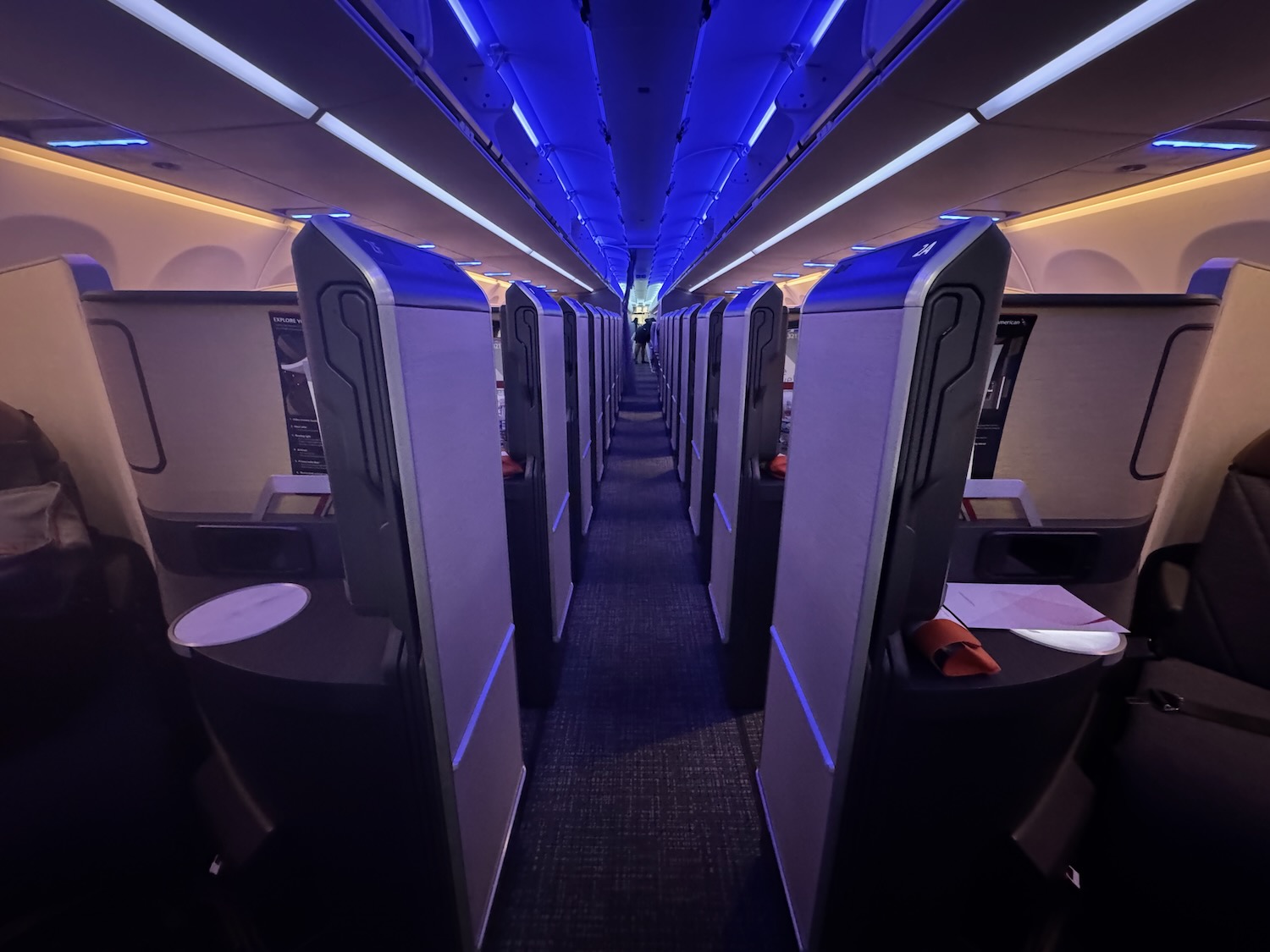 a row of rows of seats in an airplane