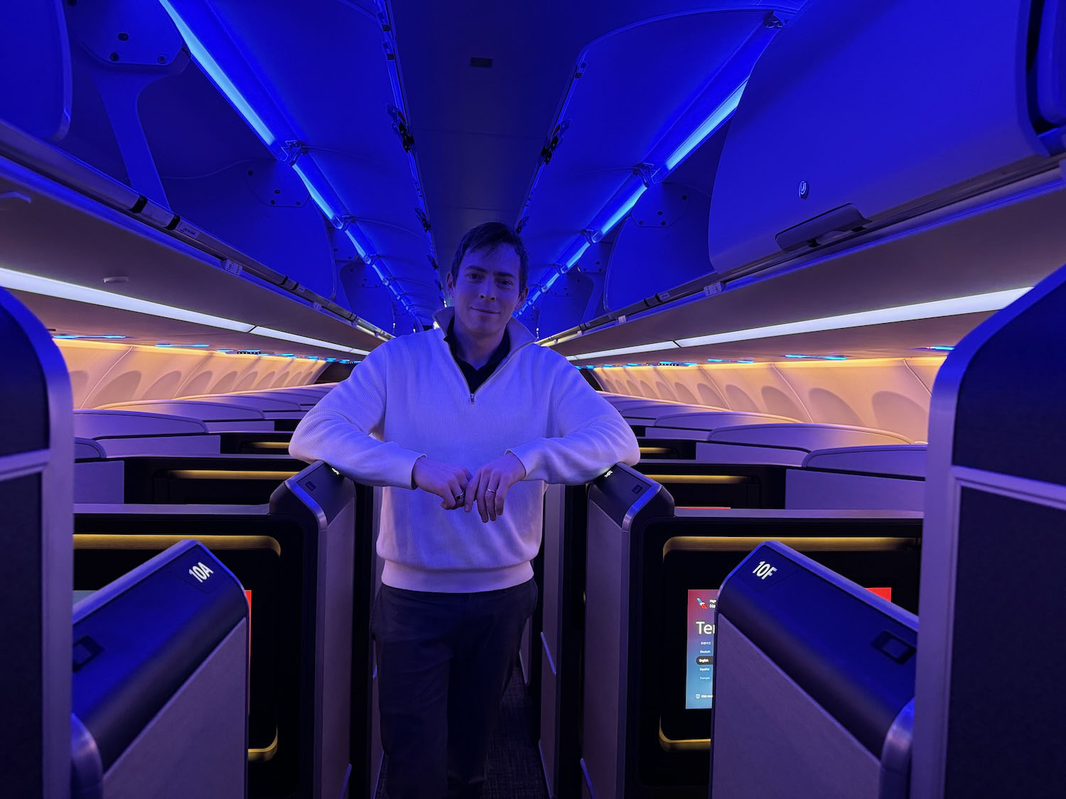 a man standing in an airplane