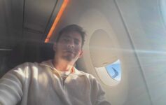 a man taking a selfie in an airplane