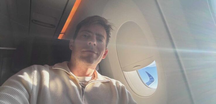 a man taking a selfie in an airplane