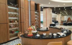 a man sitting at a counter in a hotel