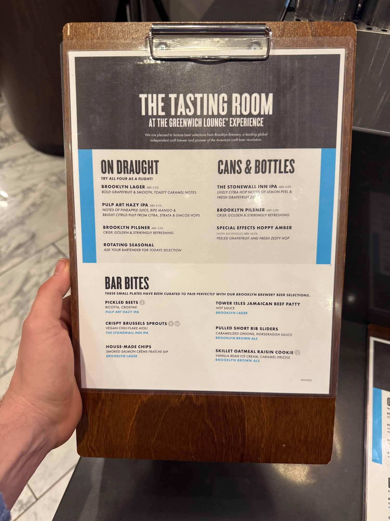 a hand holding a sign