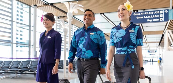 a group of people walking with luggage