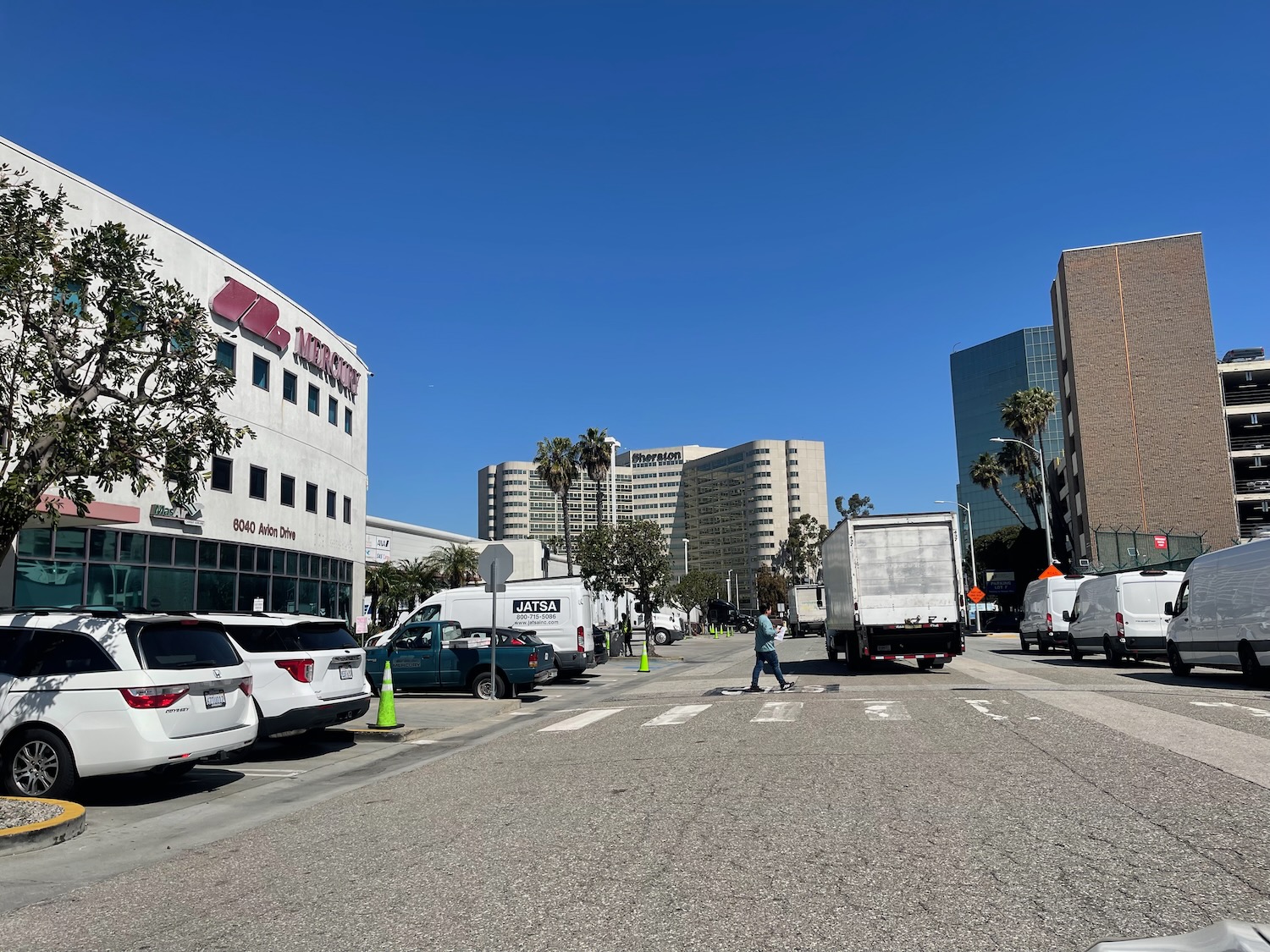 a street with cars and buildings