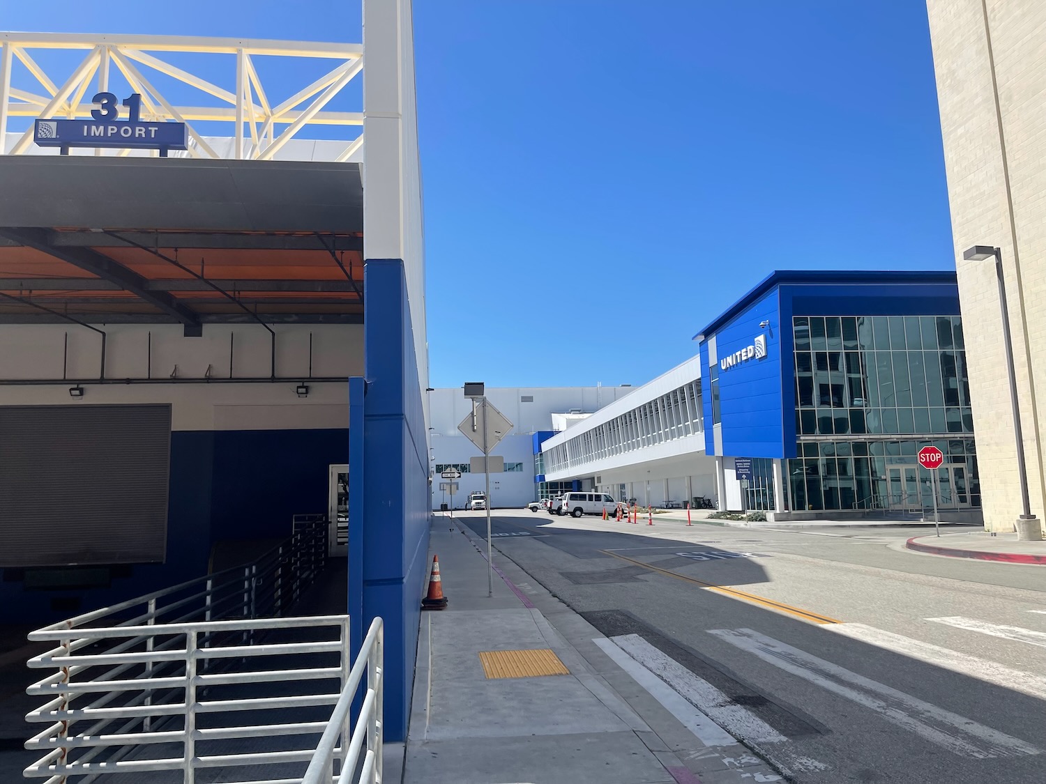 a building with a ramp and a parking lot