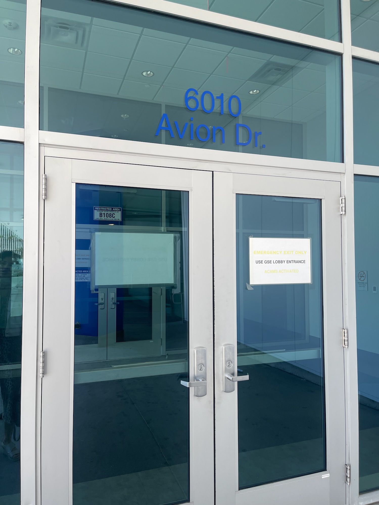 a glass doors with signs on it