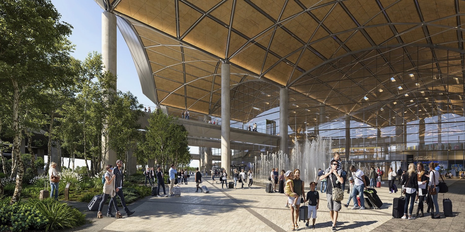 a group of people walking around a fountain