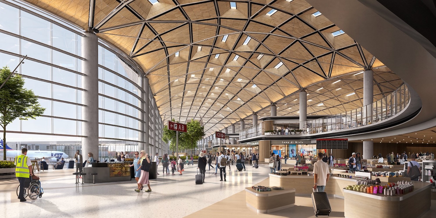 a large airport terminal with many people walking around
