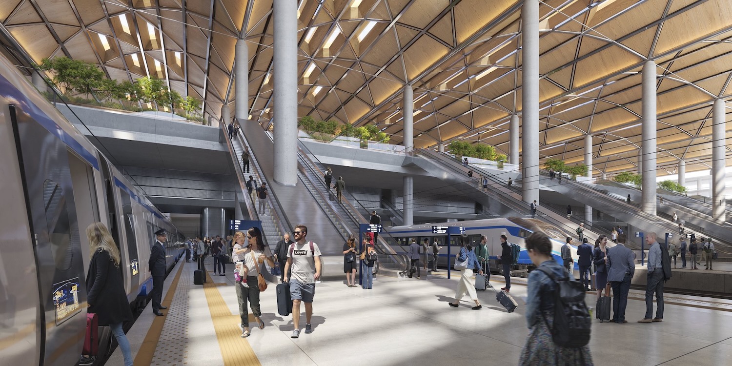 a group of people walking in a train station