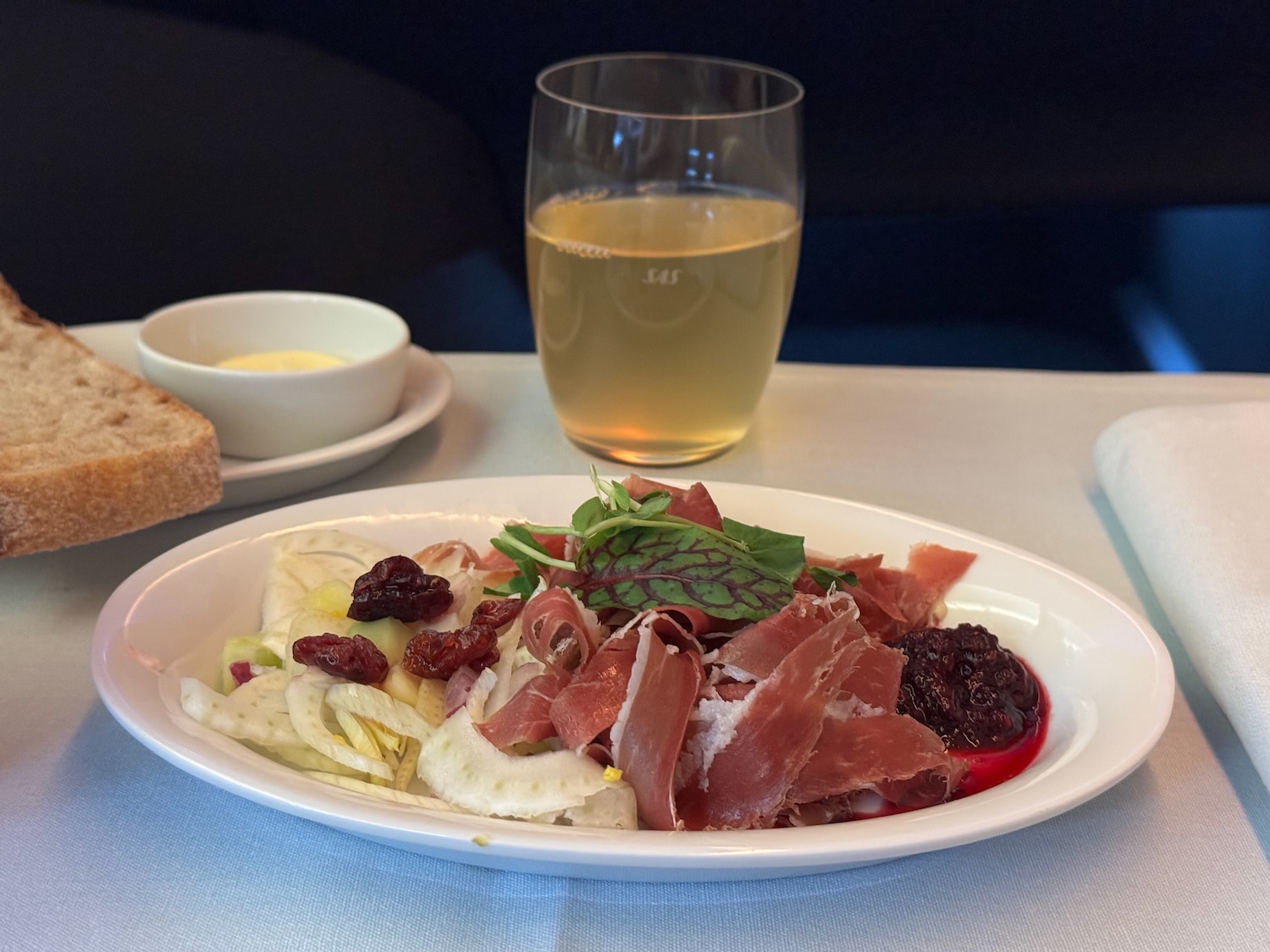 a plate of food and a glass of wine