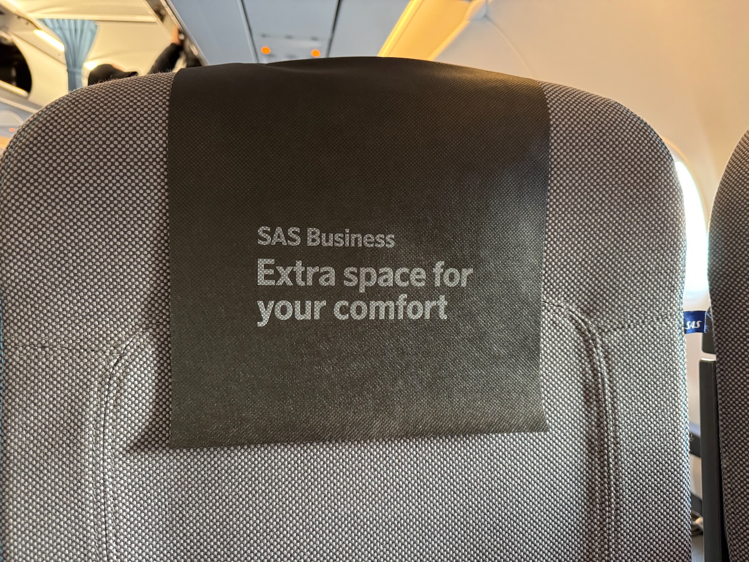 a black sign on a seat