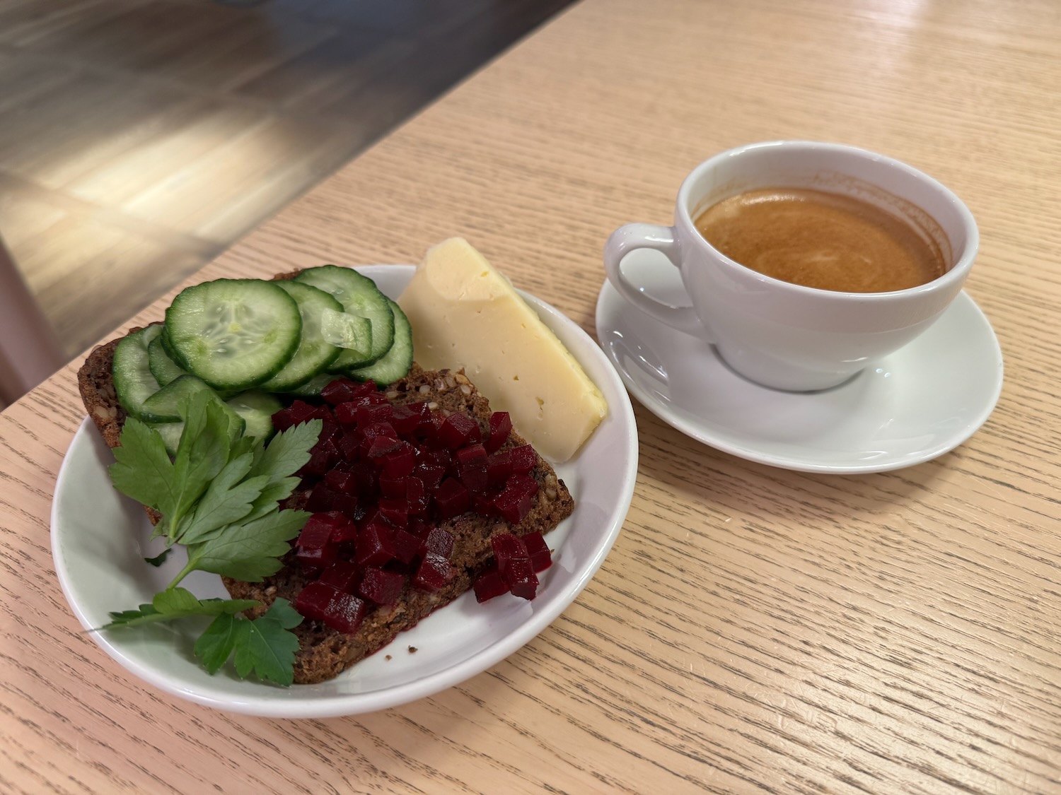 a plate of food and a cup of coffee