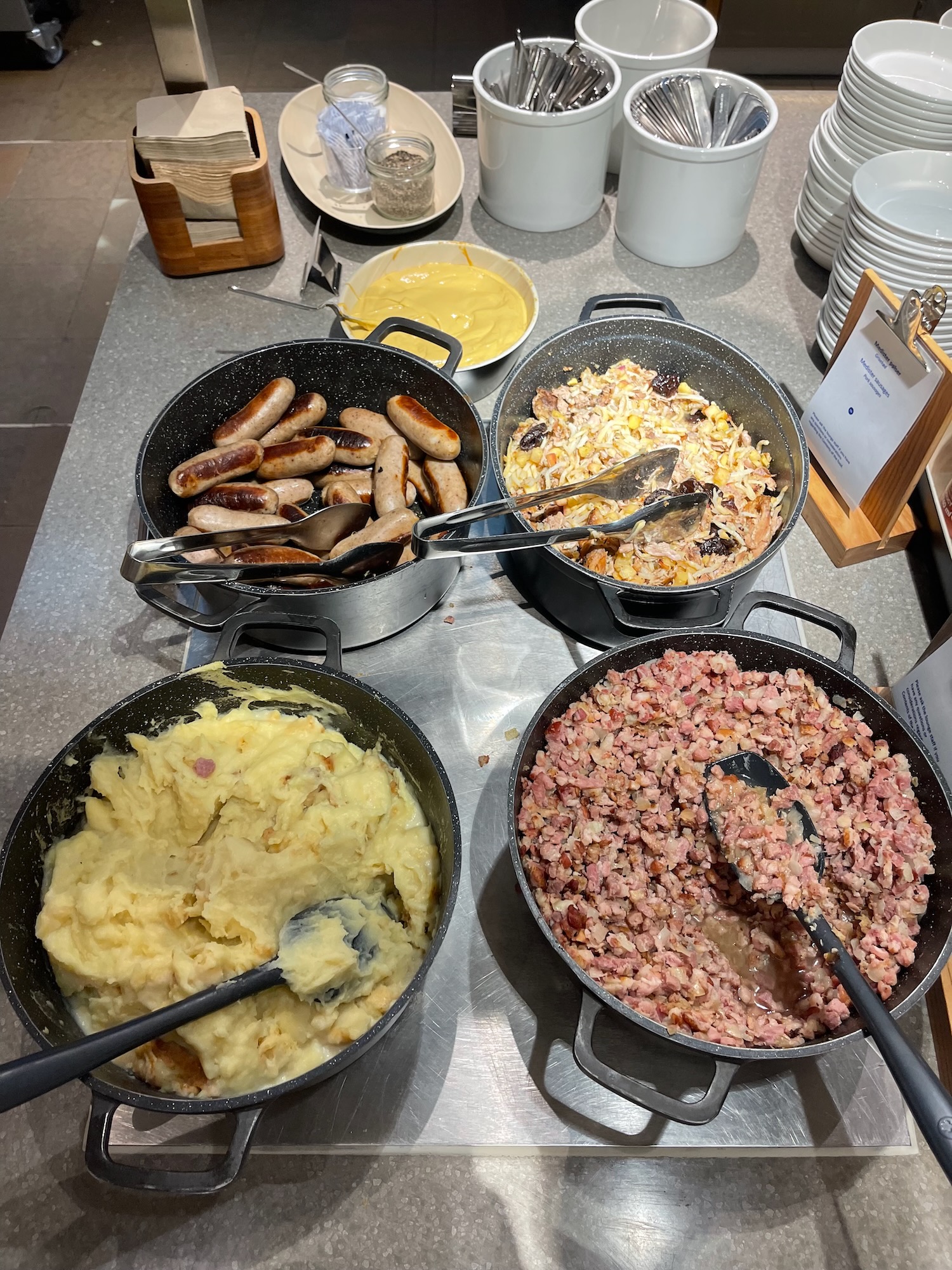 a group of pans with food in them