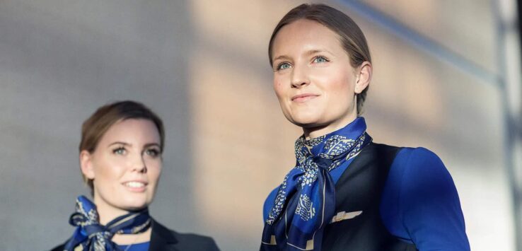 a couple of women wearing blue and black uniforms