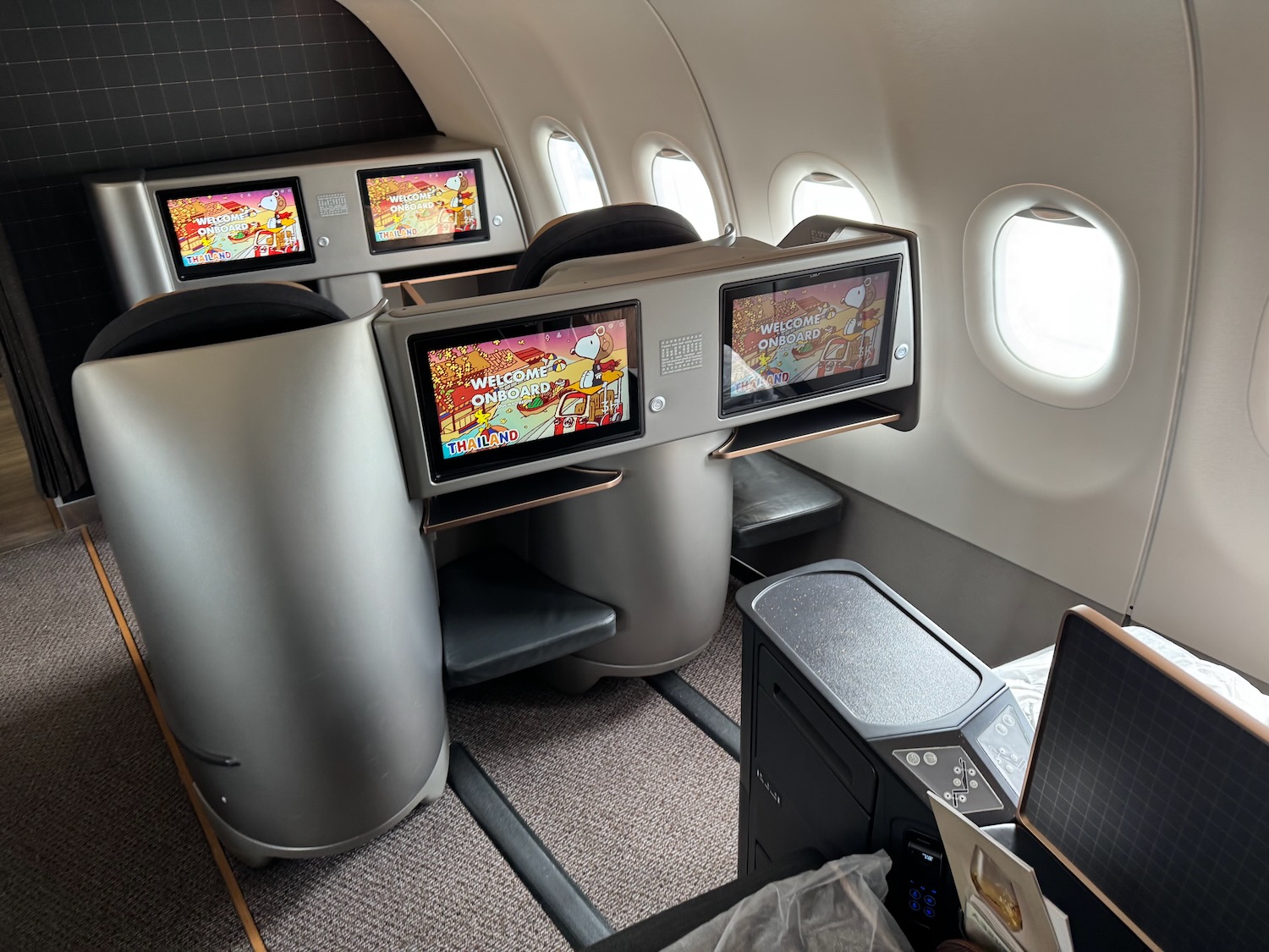 a row of screens in an airplane