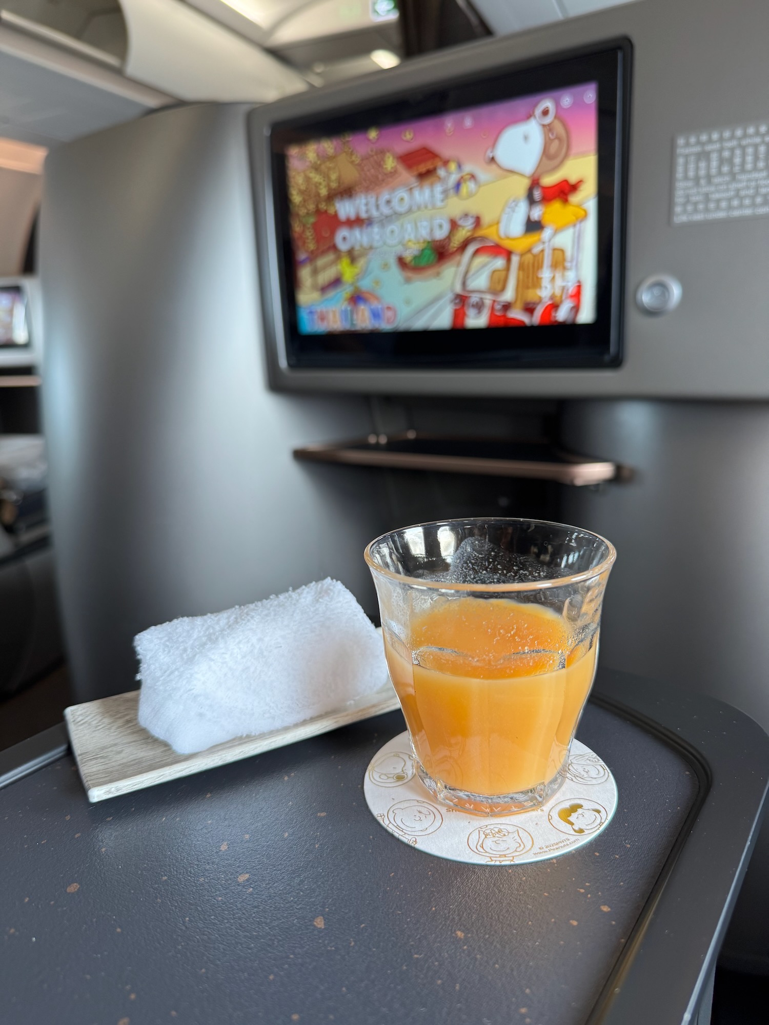 a glass of orange juice on a table
