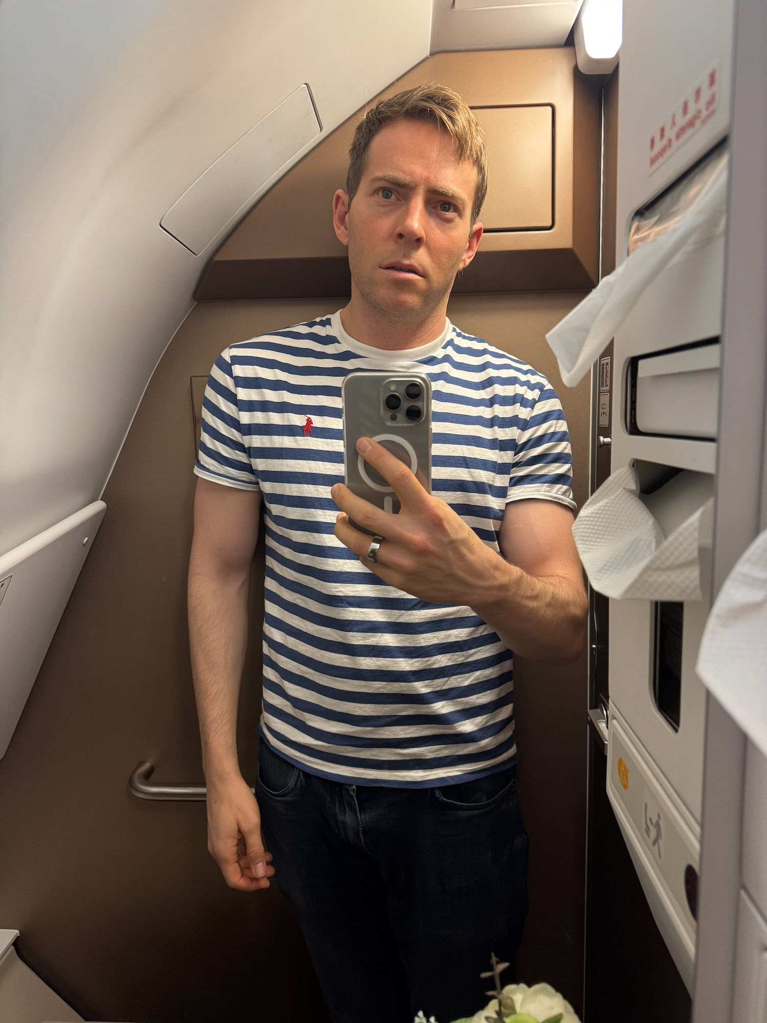 a man taking a selfie in an airplane