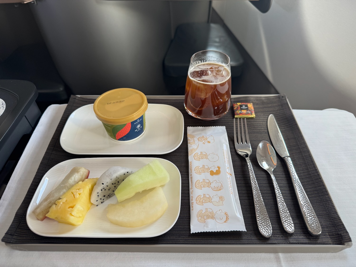 a tray with food and a drink on it