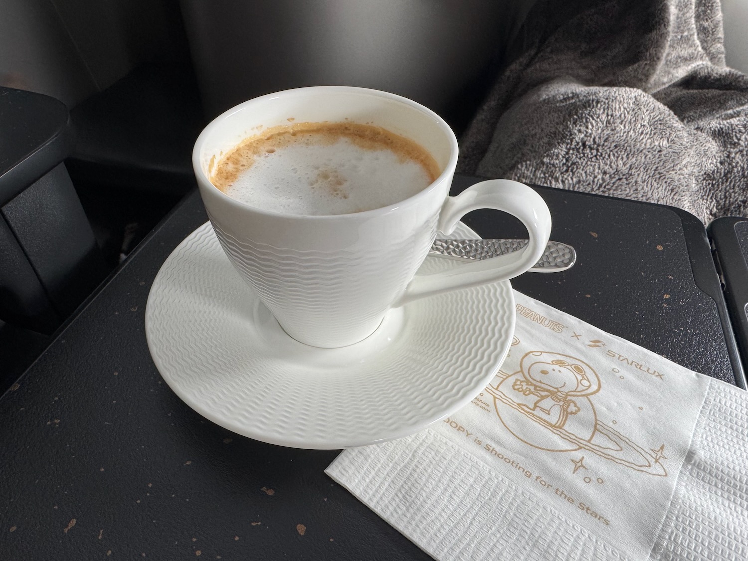 a cup of coffee on a napkin