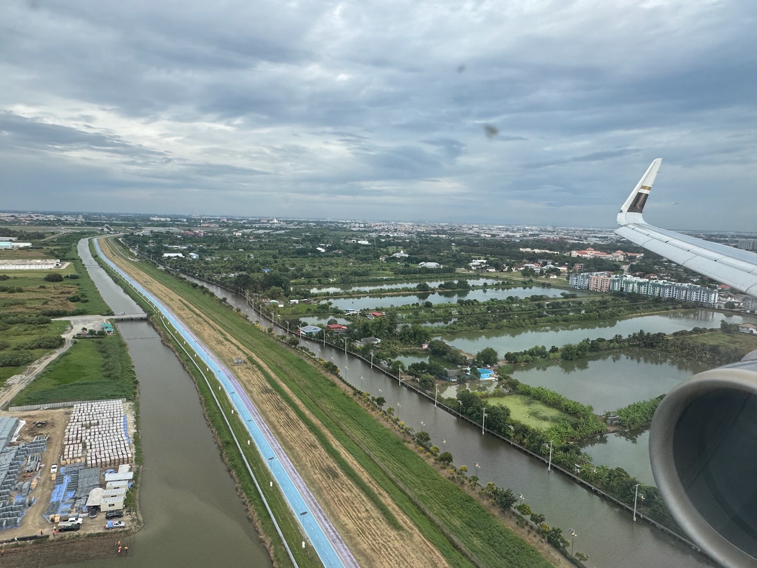 a view of a river and a city from an airplane window