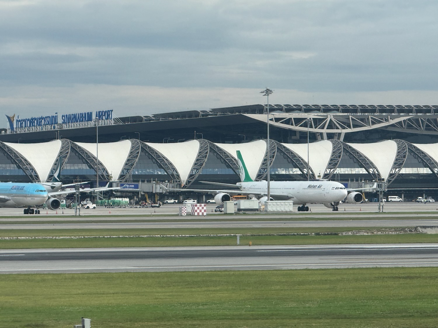 a large white airplane on a runway