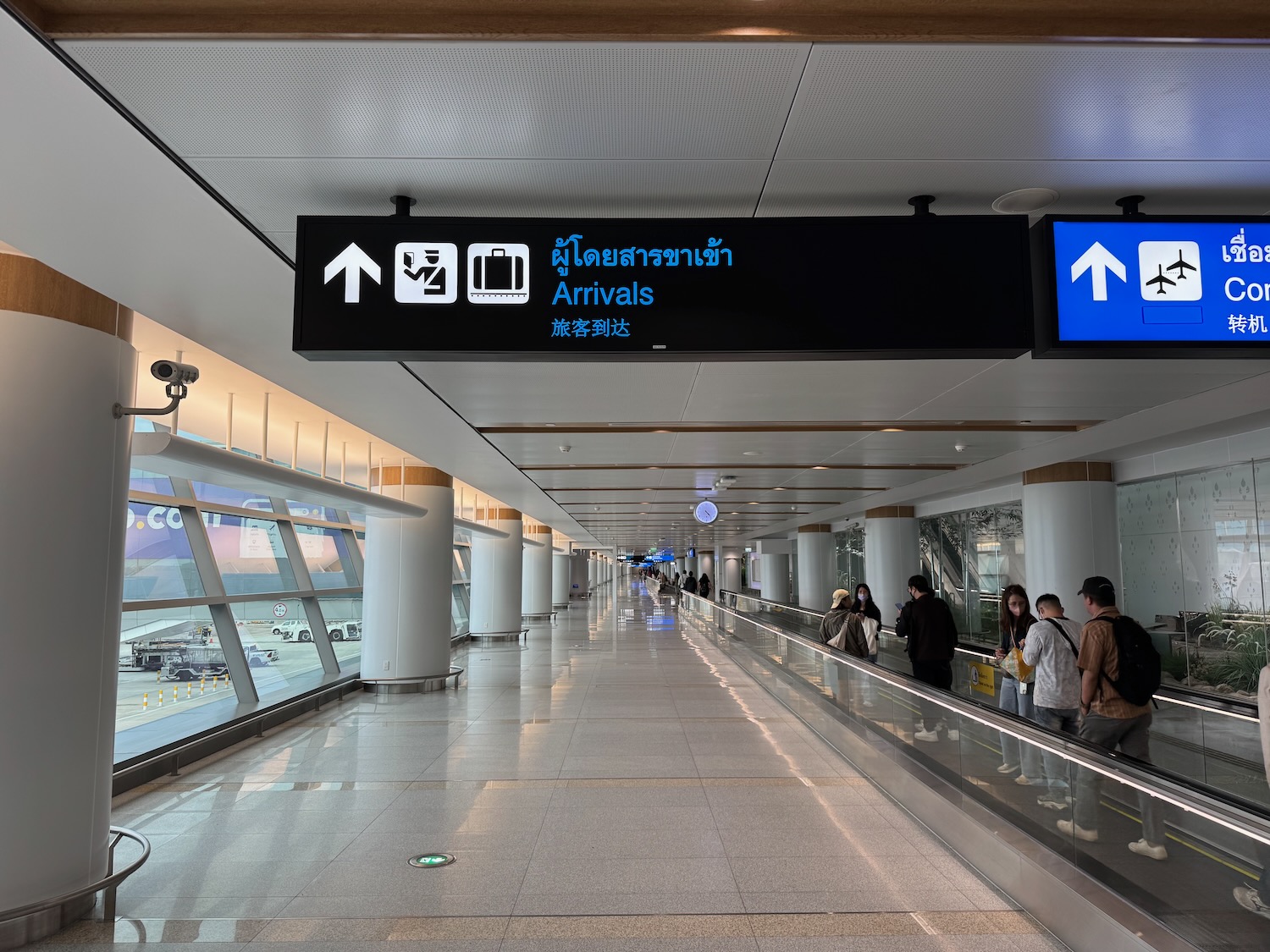 a group of people on an escalator