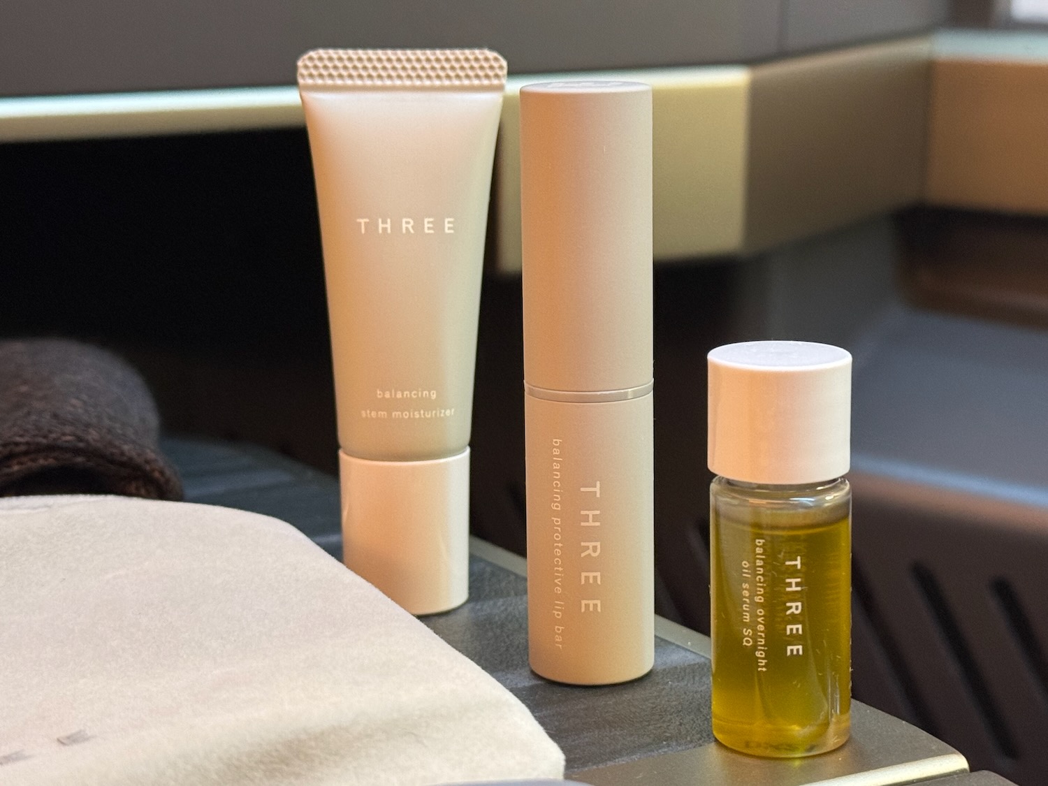 a group of cream bottles and a small bottle