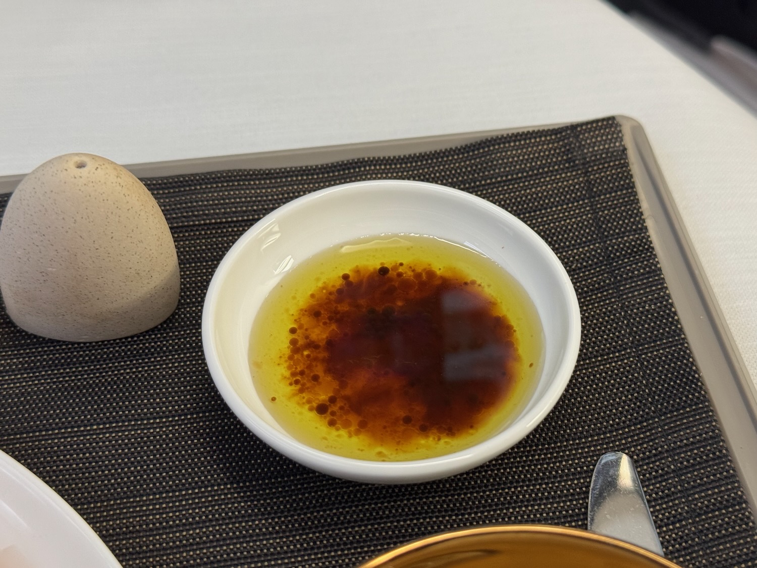 a bowl of oil and a egg