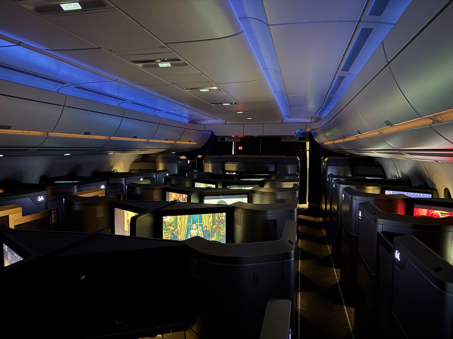 a row of televisions in an airplane